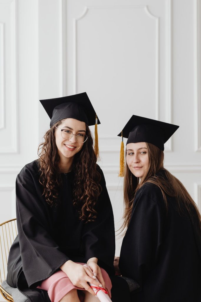 Macquarie University's international scholarships . Women Sitting Wearing Academic Dress