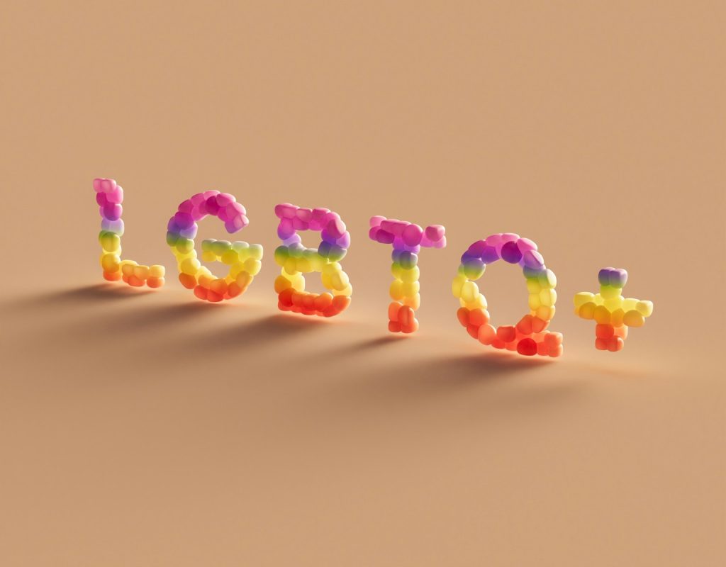 LGBTQ scholarships. a word made out of plastic letters on a brown background